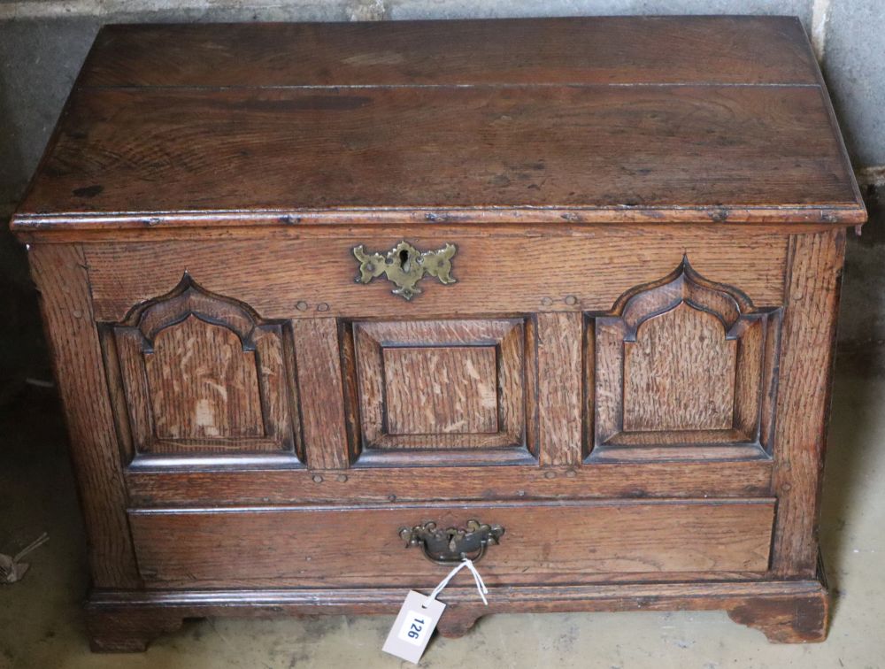 A 19th century oak coffer bach, having detachable planked top over panel front and drawer, width 67cm depth 47cm height 46cm